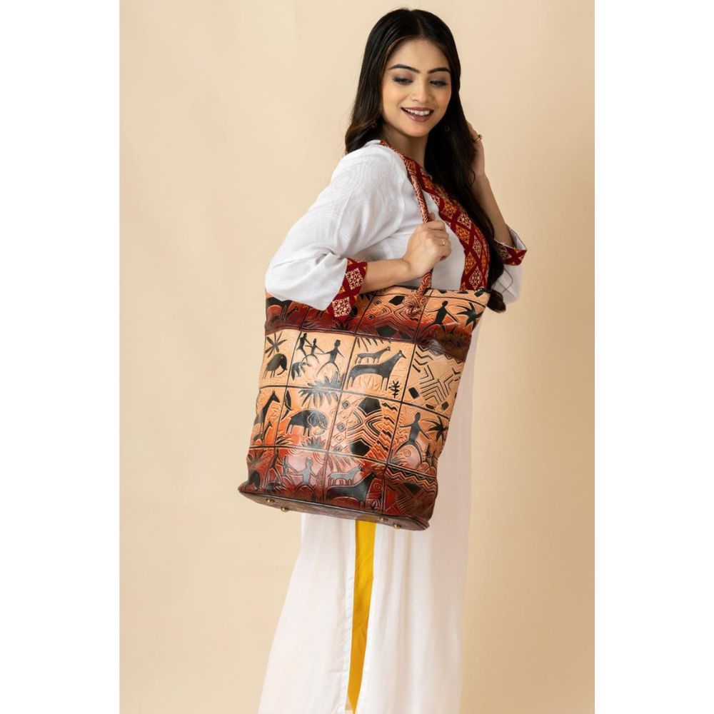 Hand-embossed Shantiniketan leather bag in brown by TANN IN