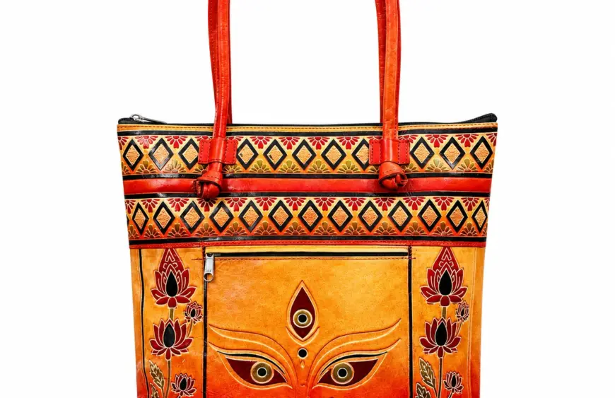 TANN IN Durga motif genuine leather tote bag for women in orange and red with lotus borders and shoulder handles